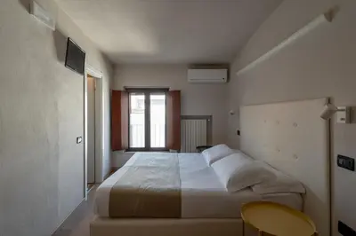 Letto o letti in una camera di Ca' Tazzoli, MantegnaHotels
