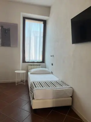 Letto o letti in una camera di Residenza Accademia, MantegnaHotels