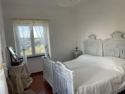 Letto o letti in una camera di Ca' Bianca