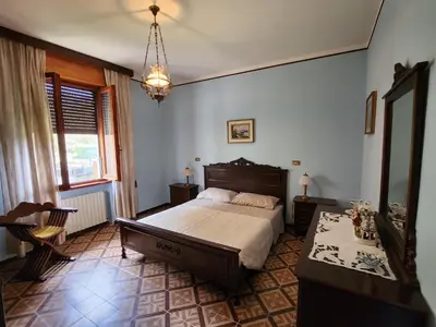 Letto o letti in una camera di B&B di Giuseppe Pighi