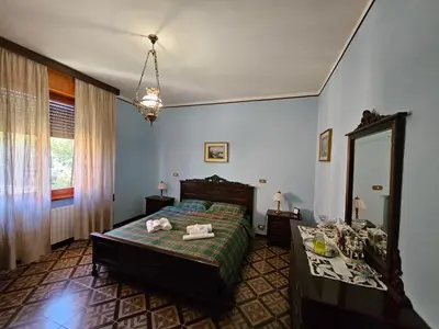 Letto o letti in una camera di B&B di Giuseppe Pighi