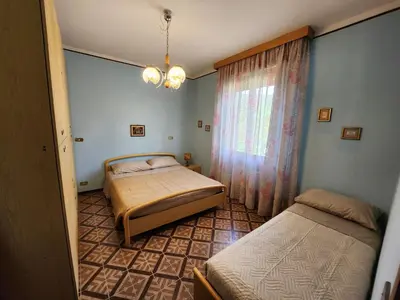Letto o letti in una camera di B&B di Giuseppe Pighi