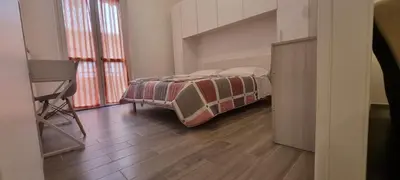 Letto o letti in una camera di Casa Roma