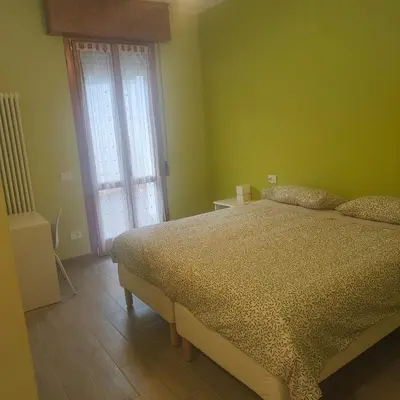 Letto o letti in una camera di B&B Canossalpaca