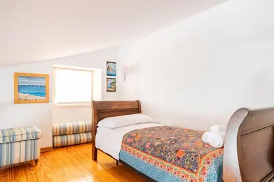 Letto o letti in una camera di Casa Elvira - Centro storico sul mare a Rapallo
