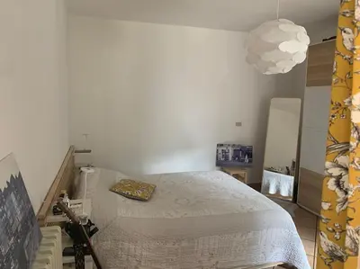 Letto o letti in una camera di Castagneti House -14 km dalla FERRARI
