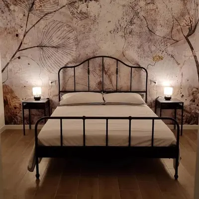 Letto o letti in una camera di B&B Via Guareschi