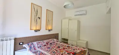 Letto o letti in una camera di Casa del Mare- Bluchalet