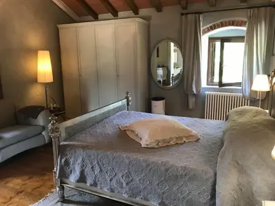 Letto o letti in una camera di Casale del Pozzo-Villa with pool - Fosdinovo in the borgo of Pulica