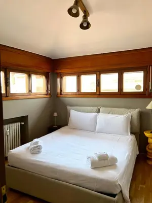Letto o letti in una camera di La Mansardina