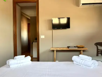 Letto o letti in una camera di La Mansardina