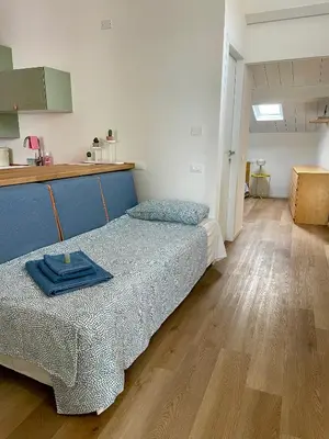 Letto o letti in una camera di TINTORIA - Manu Maison