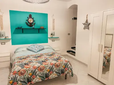 Letto o letti in una camera di Il Nido sullo Scoglio