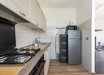 Cucina o angolo cottura di JOIVY Villa Guanna - Charming Flat with Garden