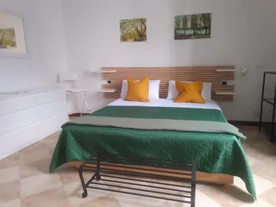 Letto o letti in una camera di affittacamere IL GIARDINO la spezia cinque terre