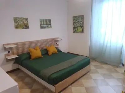 Letto o letti in una camera di affittacamere IL GIARDINO la spezia cinque terre