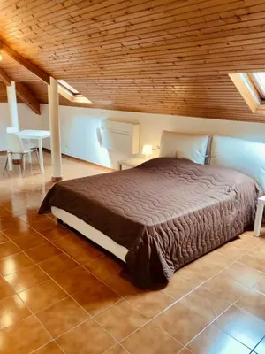 Letto o letti in una camera di CASTAGNETO 8