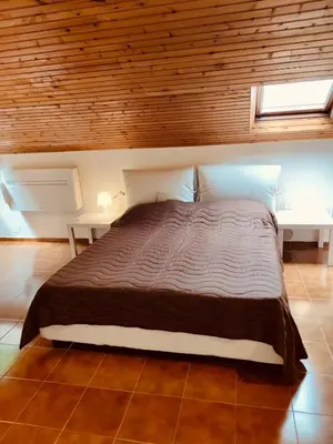 Letto o letti in una camera di CASTAGNETO 8