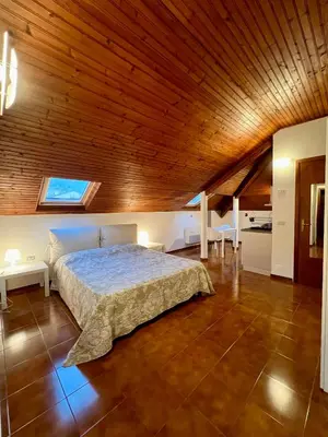 Letto o letti in una camera di CASTAGNETO 11