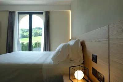 Letto o letti in una camera di Agriturismo I Tre Colli -Rubbiano-
