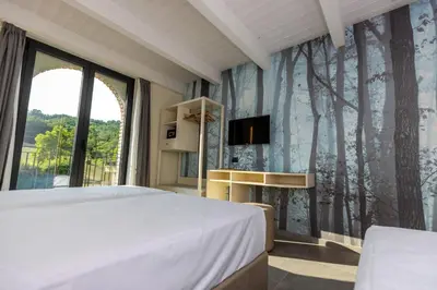 Letto o letti in una camera di Agriturismo I Tre Colli -Rubbiano-