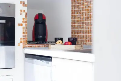 Cucina o angolo cottura di APPARTAMENTO LA MANSARDINA