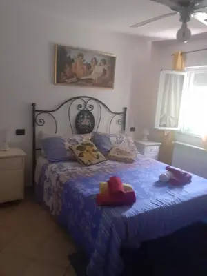 Letto o letti in una camera di Appartamento Vacanze Malù