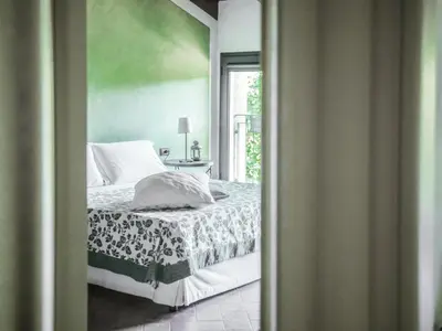 Letto o letti in una camera di Quattrocolli B&B