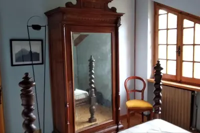 Letto o letti in una camera di La corte dei Petrani mansarda in val Borbera