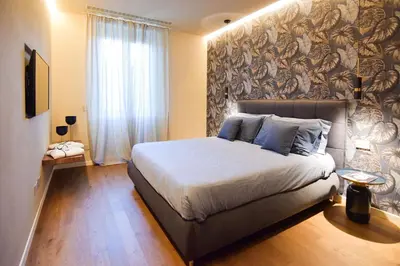 Letto o letti in una camera di Nuova Cafe' Suite
