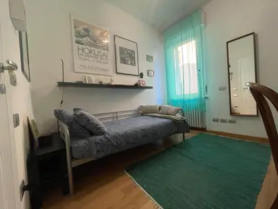Letto o letti in una camera di Appartamento casa sul fiume