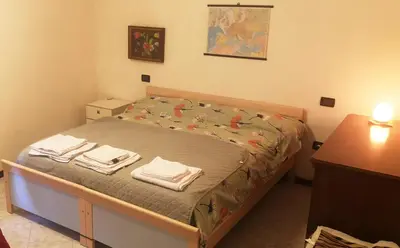 Letto o letti in una camera di Casa Romeo