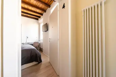 Letto o letti in una camera di Reggio Center Lovely Rooms