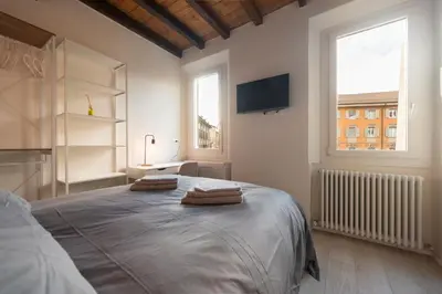 Letto o letti in una camera di Reggio Center Lovely Rooms