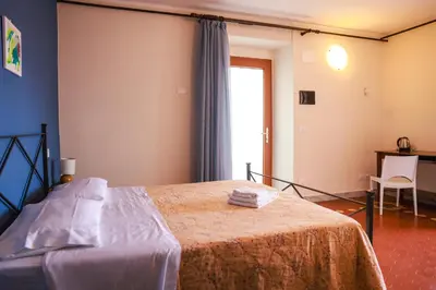 Letto o letti in una camera di Affittacamere Borgo degli Artisti boutique rooms
