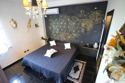 Letto o letti in una camera di B & B L'almanacco
