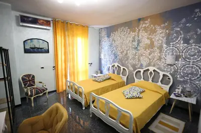 Letto o letti in una camera di B & B L'almanacco