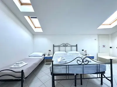 Letto o letti in una camera di La Spezia Vezzano 5 terre - Il Ciliegio
