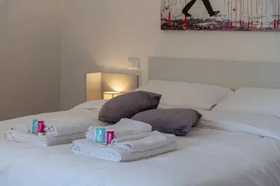 Letto o letti in una camera di FREE PARKING - Meraviglioso appartamento a Modena