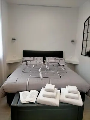 Letto o letti in una camera di Casa Antelami