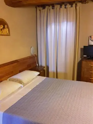 Letto o letti in una camera di Agriturismo Dosso al Porto