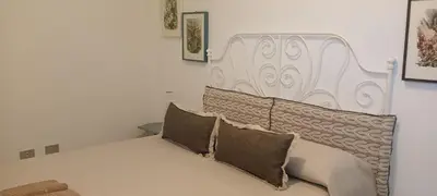 Letto o letti in una camera di Le Drupe