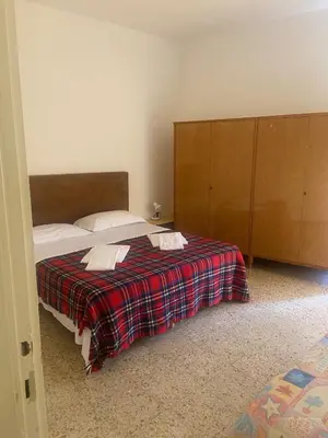 Letto o letti in una camera di Casa Marchelli