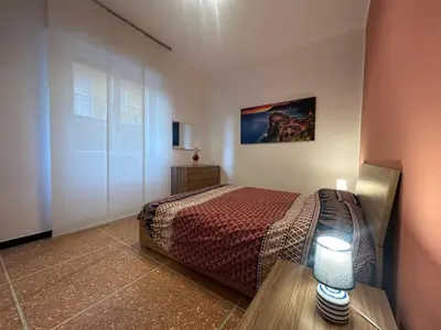 Letto o letti in una camera di Nuovo appartamento Vicino a Portofino