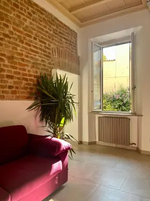 Area soggiorno di Dimora Boezio7, cozy and charming place in center with private parking