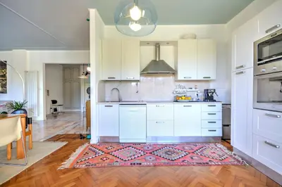 Cucina o angolo cottura di Ca' Muna - Sea View Penthouse, Private Rooftop, Walking to the Beach