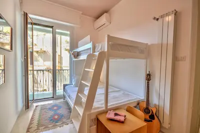 Letto o letti in una camera di Ca' Muna - Sea View Penthouse, Private Rooftop, Walking to the Beach