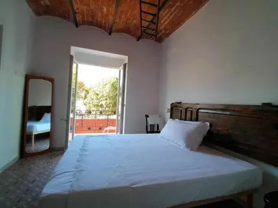 Letto o letti in una camera di AFFITTACAMERE SobborgoSpina47
