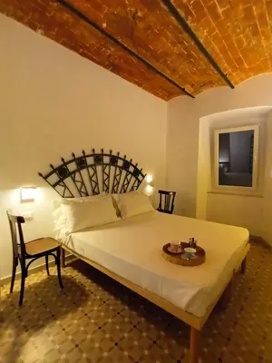 Letto o letti in una camera di AFFITTACAMERE SobborgoSpina47