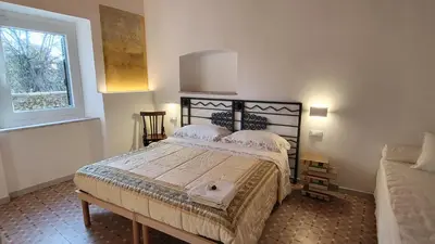 Letto o letti in una camera di AFFITTACAMERE SobborgoSpina47